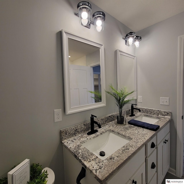 129 E 5th St, Valparaiso, NE 68065 - bathroom featuring toilet and double vanity
