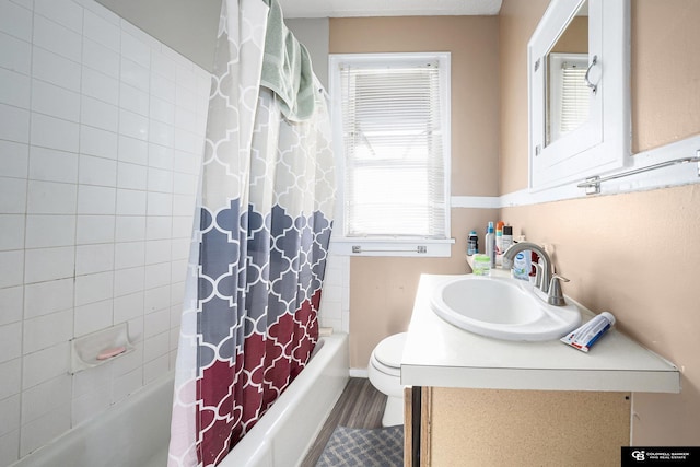 2406 J St, Lincoln, NE 68510 - full bathroom featuring shower / tub combo, toilet, and vanity