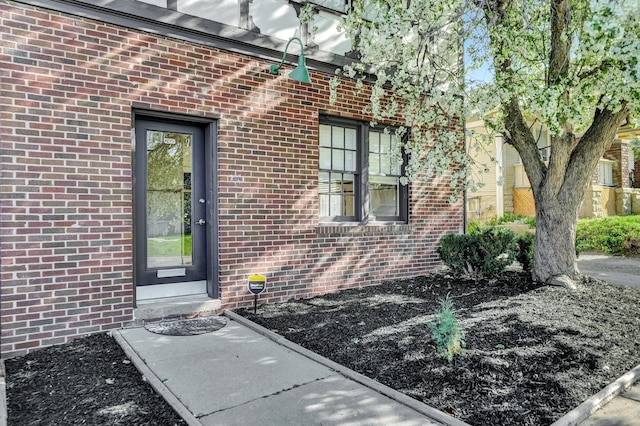 2406 J St, Lincoln, NE 68510 - property entrance featuring brick siding