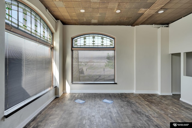 2406 J St, Lincoln, NE 68510 - empty room with wood finished floors, plenty of natural light, recessed lighting, and baseboards