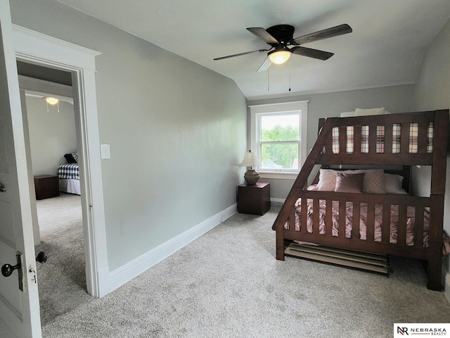 6512 Maple St, Omaha, NE 68104 - bedroom with carpet, baseboards, vaulted ceiling, and a ceiling fan