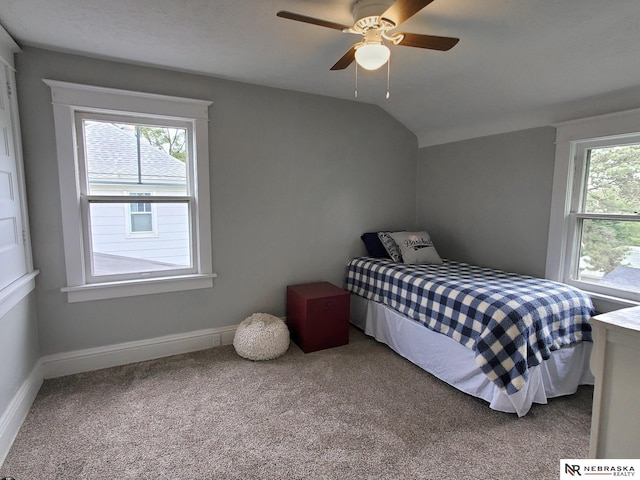 6512 Maple St, Omaha, NE 68104 - carpeted bedroom with vaulted ceiling, baseboards, and ceiling fan