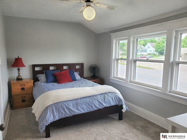 6512 Maple St, Omaha, NE 68104 - carpeted bedroom featuring multiple windows, vaulted ceiling, baseboards, and a ceiling fan