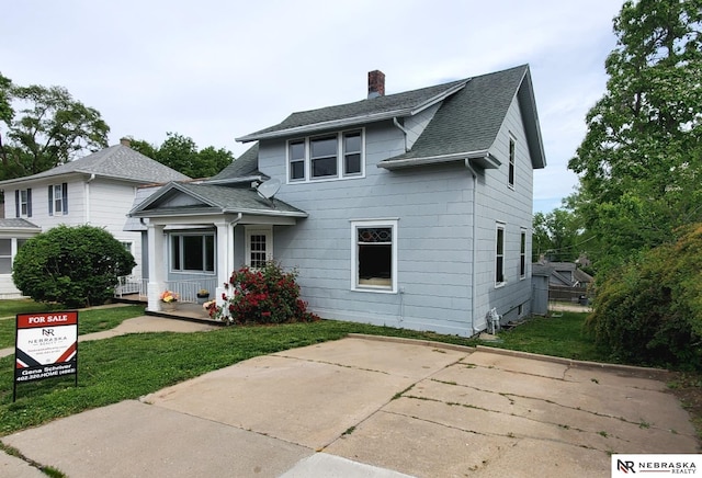 6512 Maple St, Omaha, NE 68104 - view of front of home with a shingled roof, a chimney, and a front yard