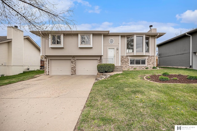 raised ranch featuring driveway, stone siding, a chimney, a front lawn, and a garage