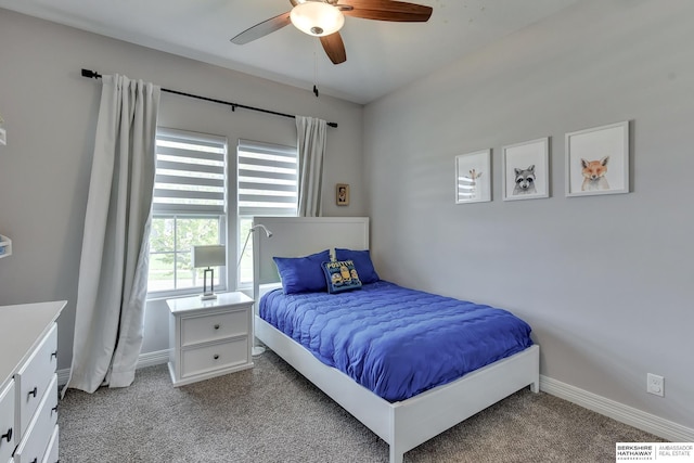 bedroom featuring baseboards, visible vents, and light carpet