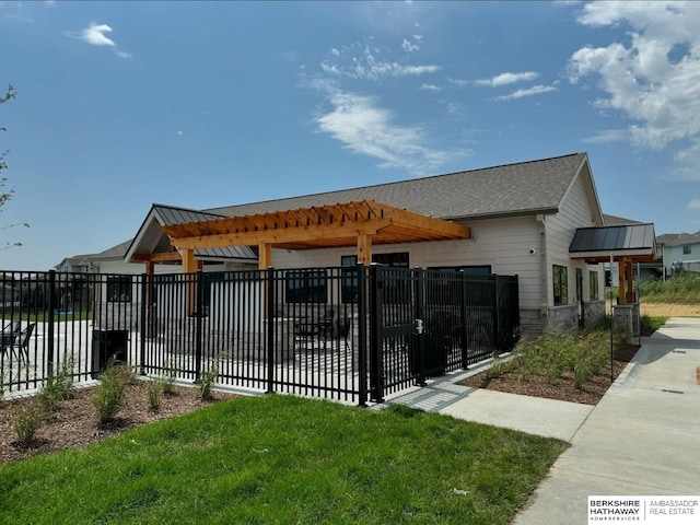 view of community with a pergola and fence private yard