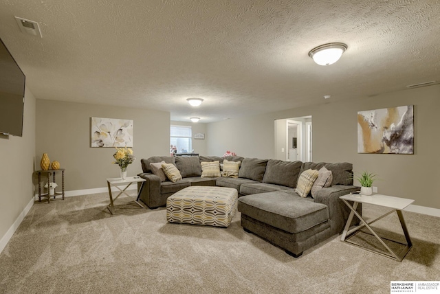 carpeted living area with a textured ceiling, visible vents, and baseboards