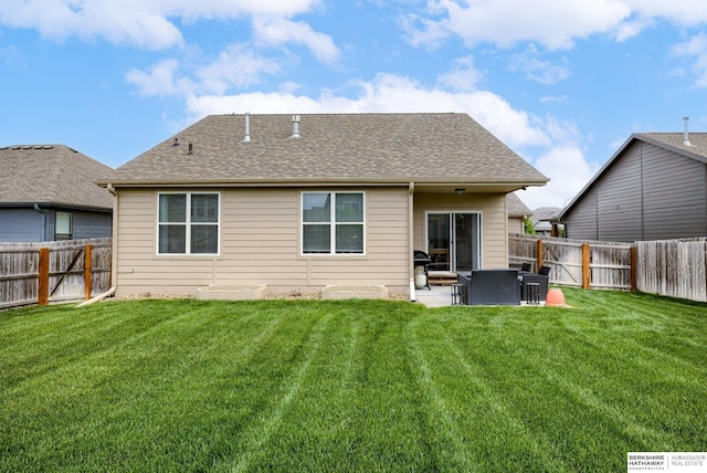 back of property featuring a lawn, a fenced backyard, and a patio area