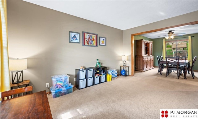 game room featuring a ceiling fan and carpet floors