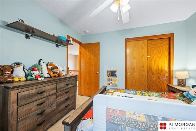 bedroom with light carpet and a ceiling fan