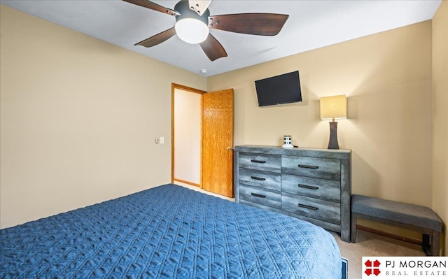 bedroom featuring dark colored carpet and a ceiling fan