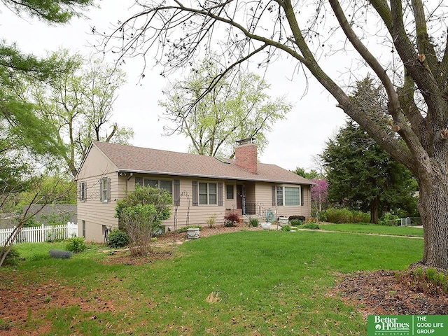 600 Ridgewood Ave, Omaha, NE 68114 - back of house with a lawn, a chimney, and fence