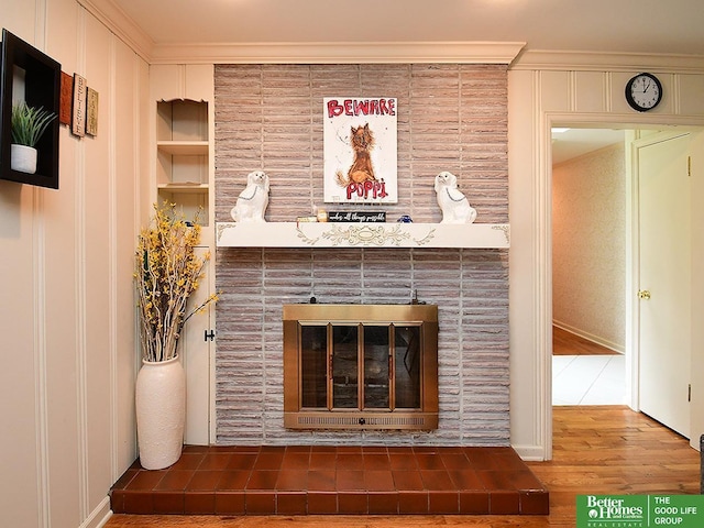 600 Ridgewood Ave, Omaha, NE 68114 - interior details with crown molding, wood finished floors, and a fireplace