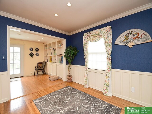 600 Ridgewood Ave, Omaha, NE 68114 - unfurnished room featuring wood finished floors, a wainscoted wall, ornamental molding, and recessed lighting
