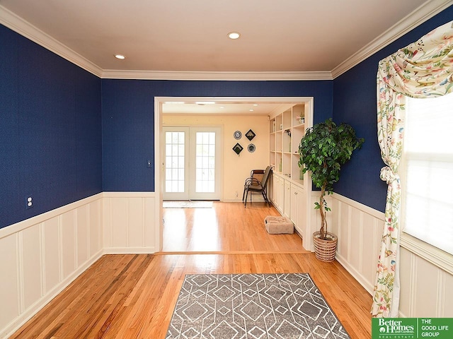 600 Ridgewood Ave, Omaha, NE 68114 - foyer with crown molding, wainscoting, and wood finished floors