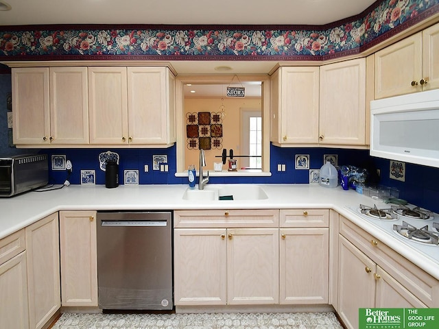 600 Ridgewood Ave, Omaha, NE 68114 - kitchen with light brown cabinets, white appliances, light countertops, and a sink