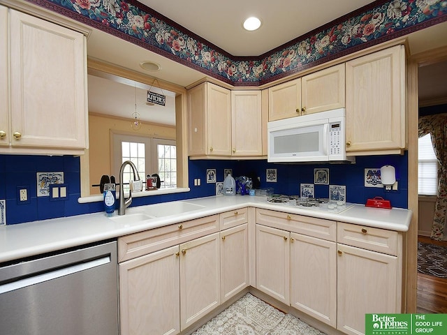 600 Ridgewood Ave, Omaha, NE 68114 - kitchen featuring light countertops, a sink, light brown cabinets, and white appliances