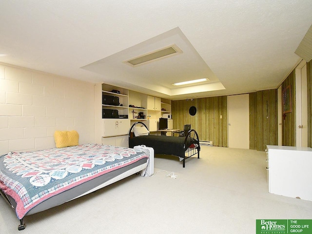 600 Ridgewood Ave, Omaha, NE 68114 - bedroom featuring wooden walls, visible vents, a baseboard heating unit, and carpet floors