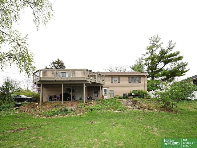 600 Ridgewood Ave, Omaha, NE 68114 - rear view of property featuring a deck and a lawn