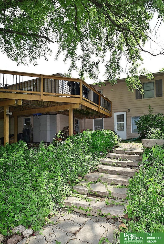 600 Ridgewood Ave, Omaha, NE 68114 - rear view of property featuring stairs and a wooden deck