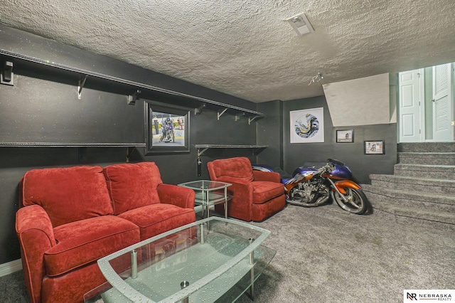 living area featuring a textured ceiling, carpet flooring, stairway, and visible vents