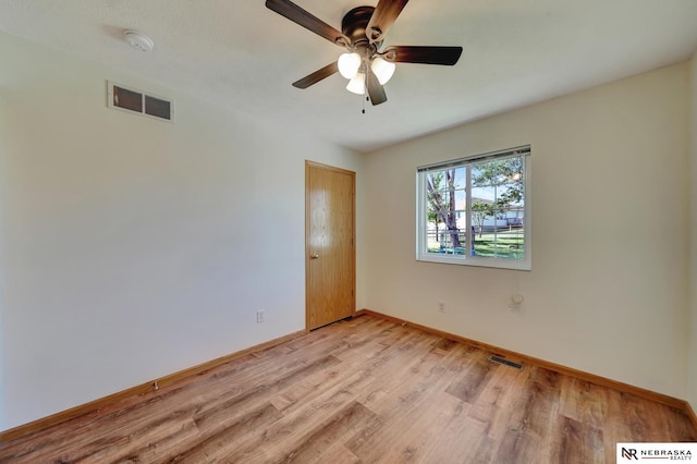 1521 Morton St, Lincoln, NE 68521 - unfurnished room featuring light wood-style floors, a smoke detector, and baseboards