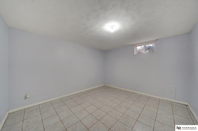 1521 Morton St, Lincoln, NE 68521 - below grade area featuring a textured ceiling and baseboards