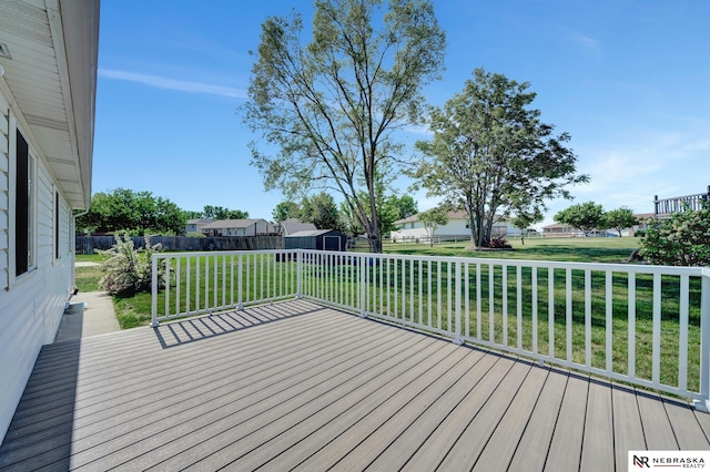 1521 Morton St, Lincoln, NE 68521 - wooden deck featuring a storage unit, an outbuilding, and a residential view