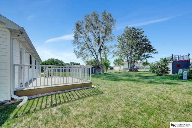 1521 Morton St, Lincoln, NE 68521 - view of green lawn with a deck