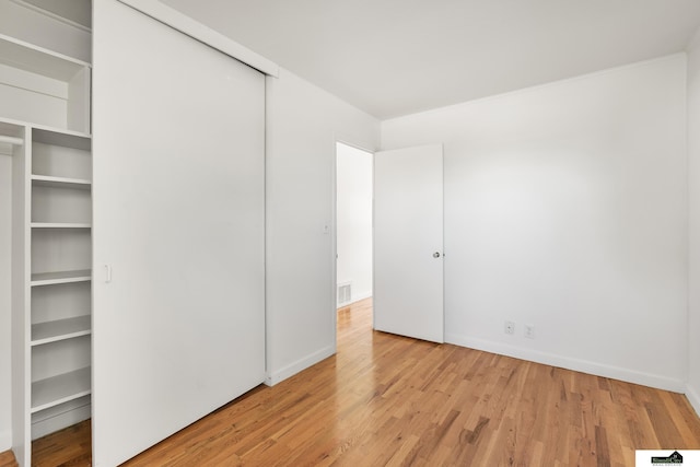 1500 Burnham St, Lincoln, NE 68502 - unfurnished bedroom featuring light wood finished floors and baseboards