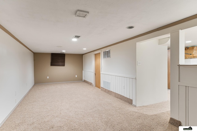 1500 Burnham St, Lincoln, NE 68502 - spare room with light carpet, crown molding, and recessed lighting