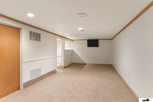 1500 Burnham St, Lincoln, NE 68502 - finished basement featuring ornamental molding, light carpet, recessed lighting, and wainscoting