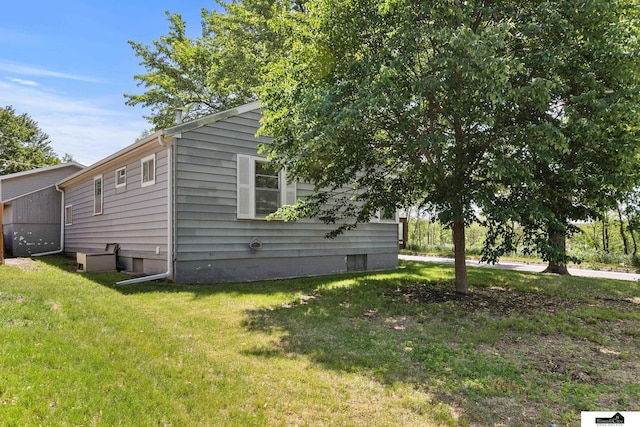 1500 Burnham St, Lincoln, NE 68502 - view of property exterior featuring a lawn