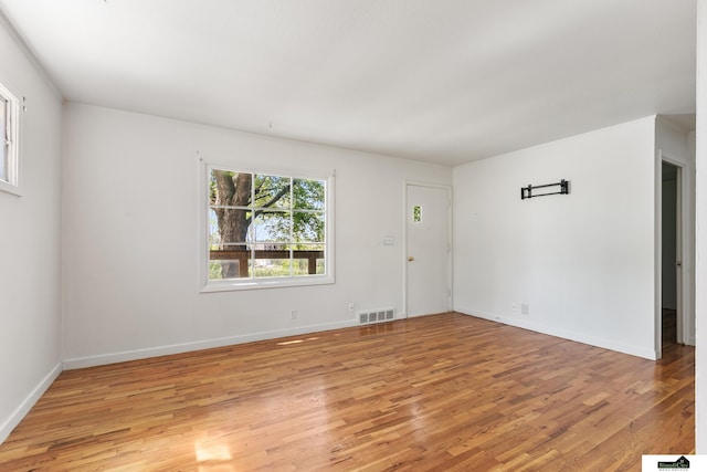 1500 Burnham St, Lincoln, NE 68502 - unfurnished room with light wood-type flooring and baseboards