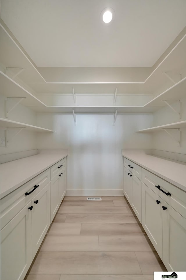 interior space with visible vents and light wood finished floors