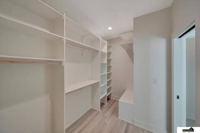 walk in closet featuring light wood-style floors