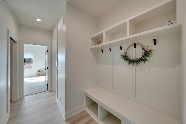 mudroom featuring visible vents, recessed lighting, light wood-style flooring, and baseboards