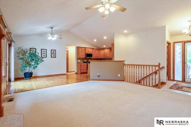 unfurnished living room with a ceiling fan, light carpet, vaulted ceiling, baseboards, and recessed lighting