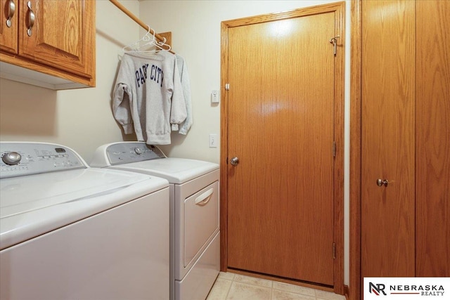 washroom featuring cabinet space and washer and dryer