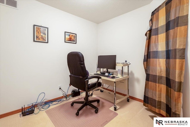 home office with carpet flooring and baseboards