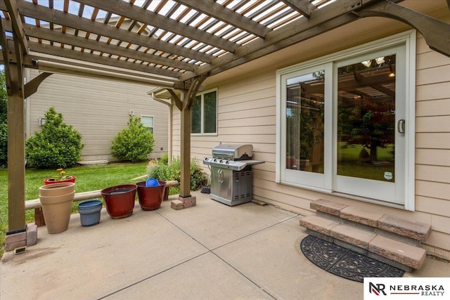 view of patio featuring a pergola and a grill