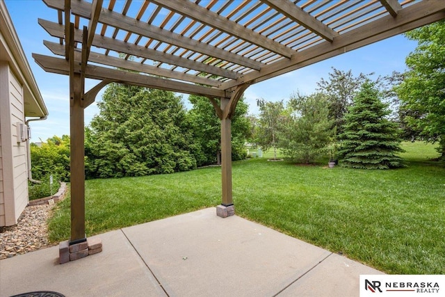 view of patio with a pergola and view of wooded area