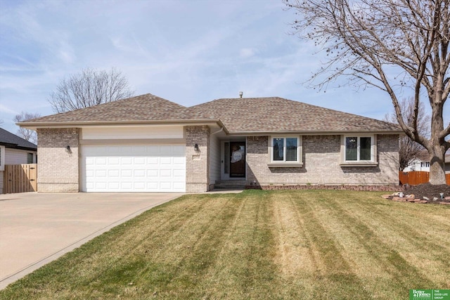 ranch-style home with fence, a front lawn, brick siding, and a garage