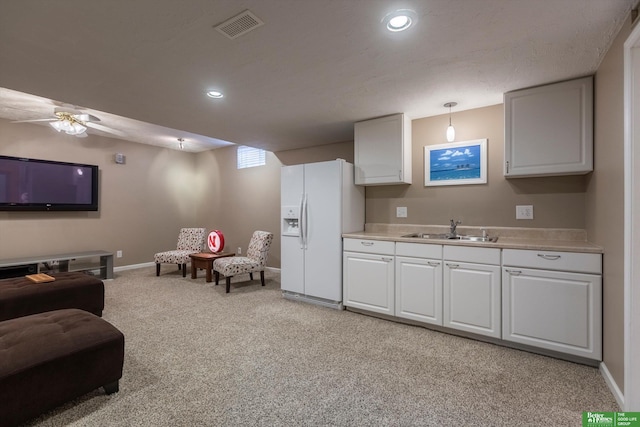 living room featuring recessed lighting, light colored carpet, ceiling fan, baseboards, and visible vents