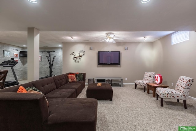 living room with baseboards, a ceiling fan, and carpet floors