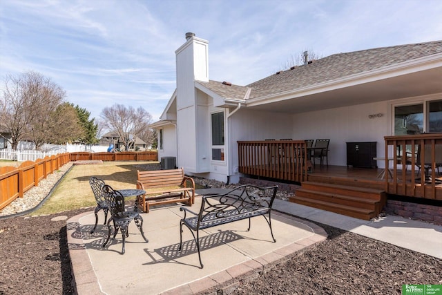 view of patio / terrace with a fenced backyard, a wooden deck, and central air condition unit