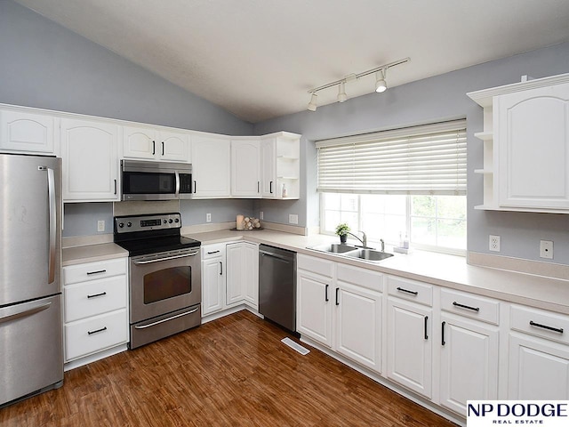 kitchen featuring open shelves, white cabinets, a sink, visible vents, and stainless steel appliances