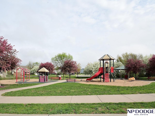 communal playground featuring a lawn