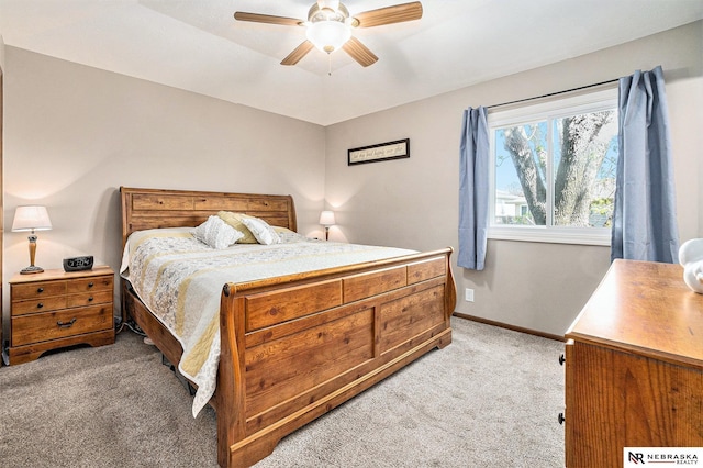 bedroom with baseboards, light carpet, and a ceiling fan